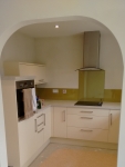 Archway in fitted kitchen